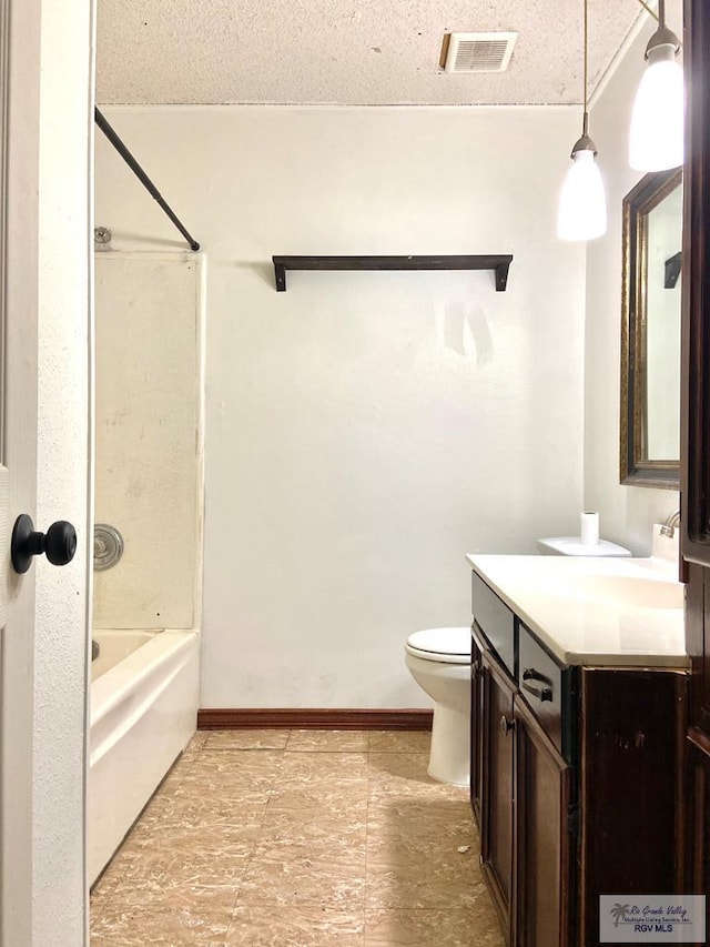 full bathroom featuring bathing tub / shower combination, vanity, a textured ceiling, and toilet