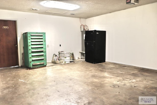 garage featuring black refrigerator