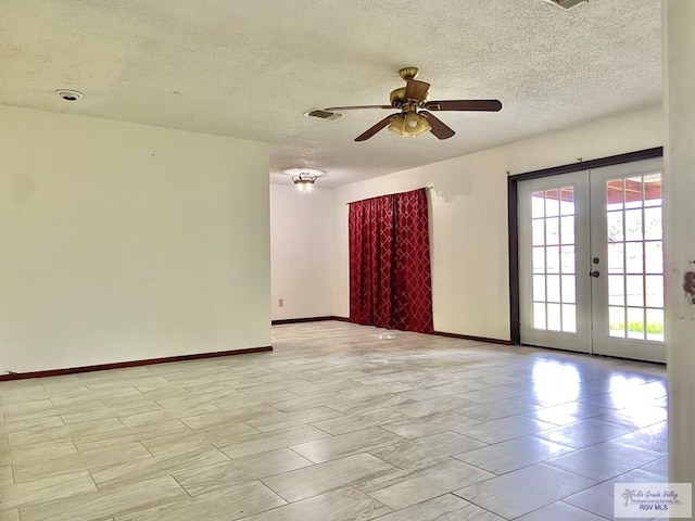 spare room with ceiling fan, a textured ceiling, and french doors