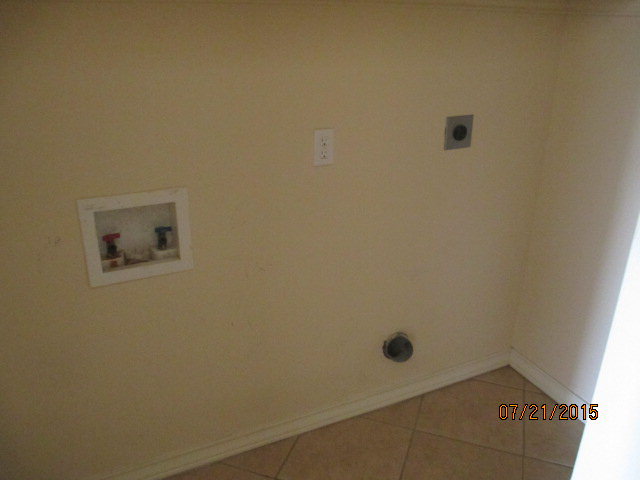 laundry area with hookup for an electric dryer, tile patterned floors, and hookup for a washing machine