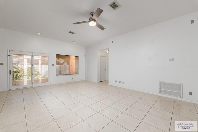 tiled spare room featuring ceiling fan