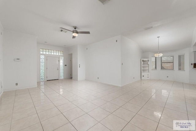 unfurnished room with light tile patterned floors and ceiling fan