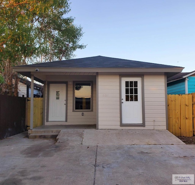 608 W Polk St, Harlingen, TX 78550 - view of front of property featuring fence and roof with shingles