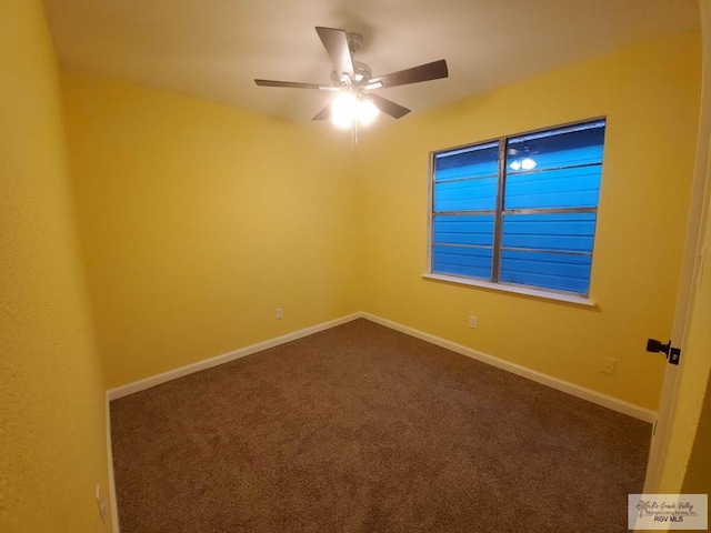 608 W Polk St, Harlingen, TX 78550 - empty room featuring dark colored carpet, a ceiling fan, and baseboards