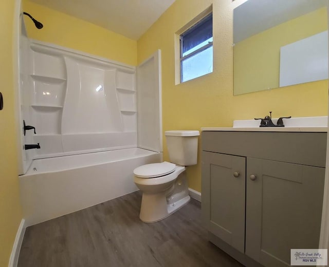 608 W Polk St, Harlingen, TX 78550 - full bathroom featuring wood finished floors, vanity, baseboards, toilet, and shower / bathtub combination