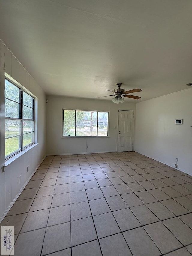 1206 S C St, Harlingen, TX 78550 - spare room with plenty of natural light, a ceiling fan, and light tile patterned flooring