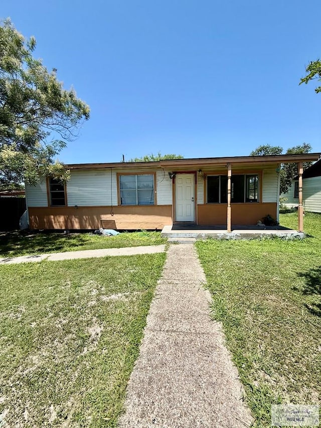1206 S C St, Harlingen, TX 78550 - ranch-style home with a front yard