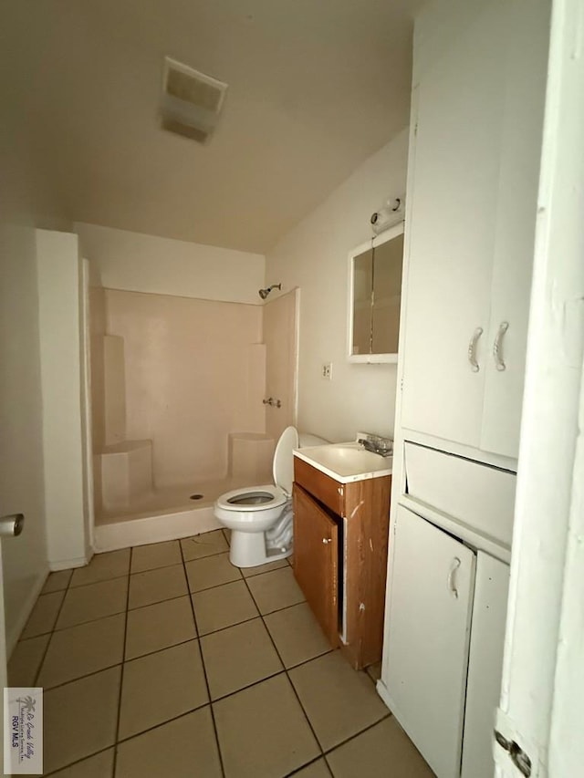 1206 S C St, Harlingen, TX 78550 - bathroom featuring a stall shower, vanity, and tile patterned floors