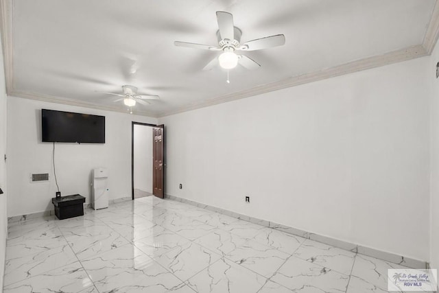 spare room with ceiling fan and crown molding