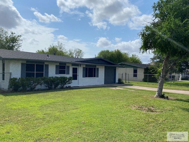 ranch-style home with a front lawn