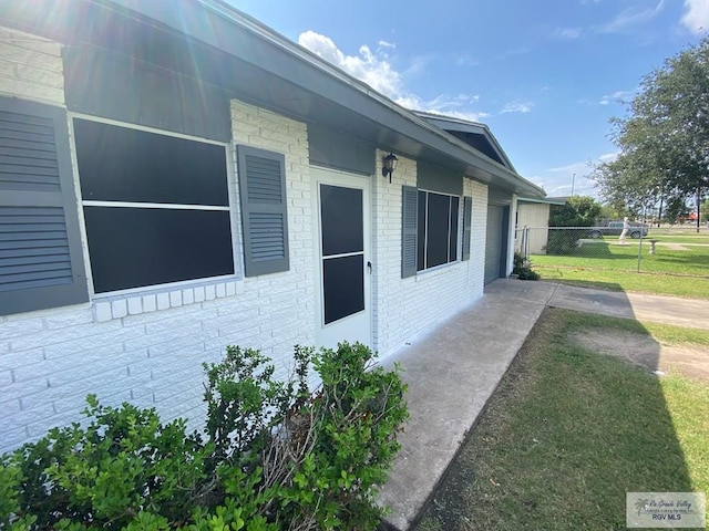 view of property exterior with a yard