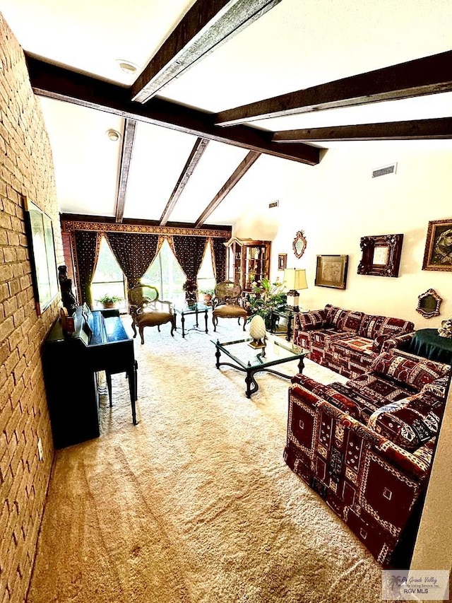 living room featuring carpet, lofted ceiling with beams, and brick wall