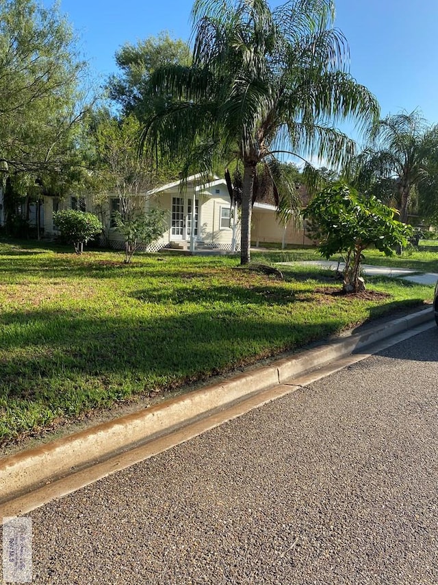 417 SE Verbena Ln Unit 23, La Feria, TX 78559 - view of front of property with a front yard