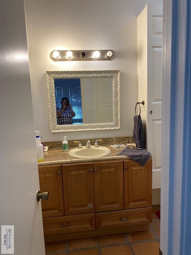417 SE Verbena Ln Unit 23, La Feria, TX 78559 - bathroom with tile patterned floors and vanity