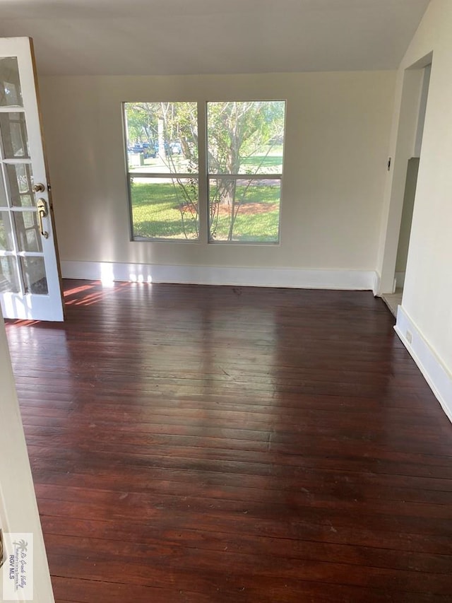 417 SE Verbena Ln Unit 23, La Feria, TX 78559 - unfurnished room with dark wood-style floors and baseboards