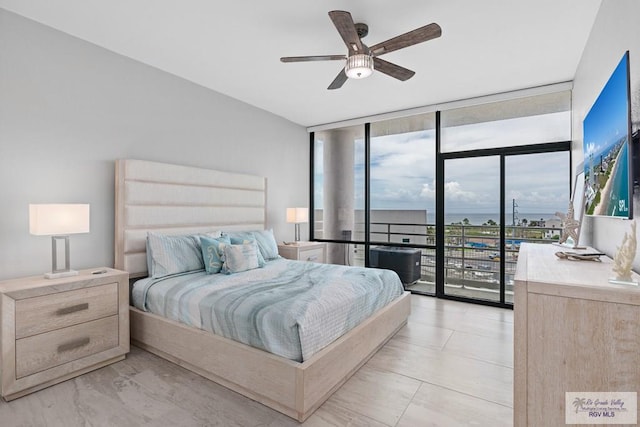 bedroom with floor to ceiling windows, a ceiling fan, and access to outside