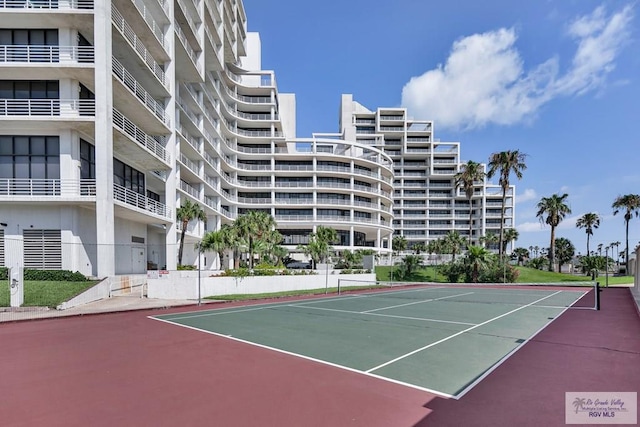 view of sport court with fence