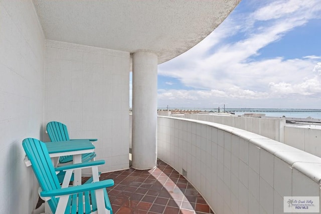 balcony featuring a water view