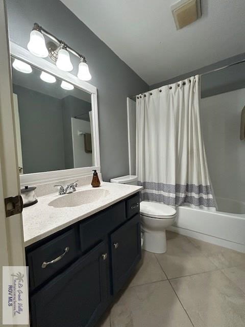 1001 Tesoro Ave, Rancho Viejo, TX 78575 - bathroom featuring vanity, toilet, shower / bath combination with curtain, tile patterned floors, and vaulted ceiling