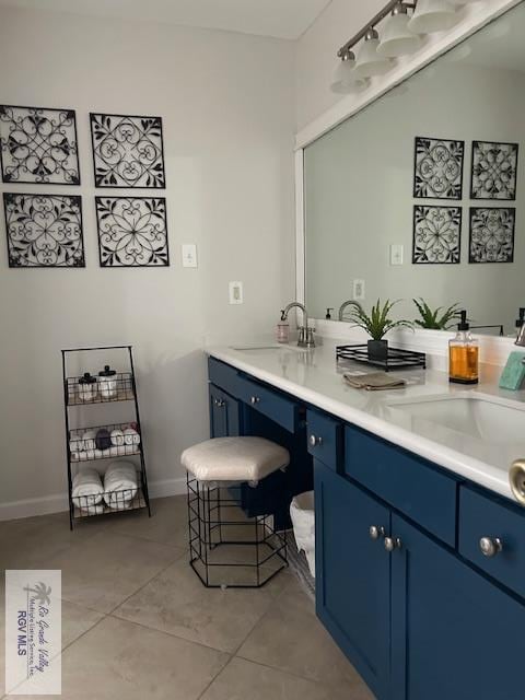 1001 Tesoro Ave, Rancho Viejo, TX 78575 - full bathroom featuring double vanity, tile patterned flooring, and baseboards