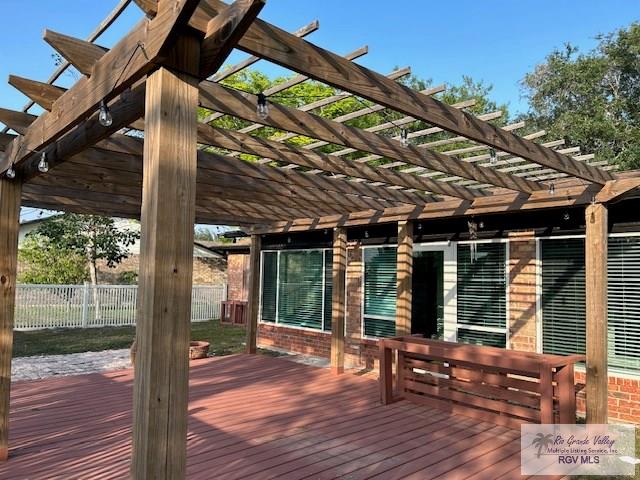 1001 Tesoro Ave, Rancho Viejo, TX 78575 - wooden terrace featuring a pergola