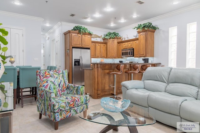 tiled living room featuring crown molding