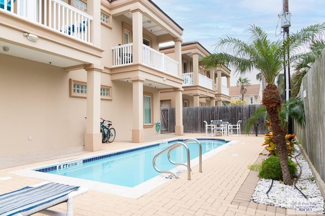 view of pool featuring a patio