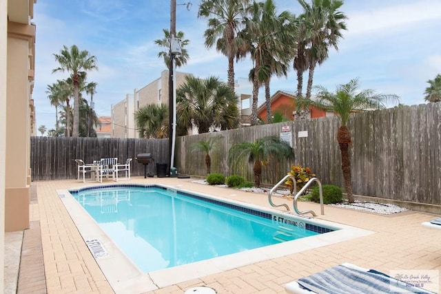 view of pool featuring a patio