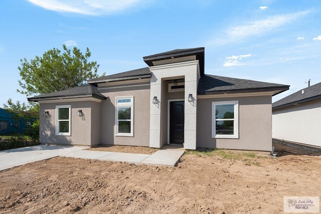 prairie-style house with stucco siding