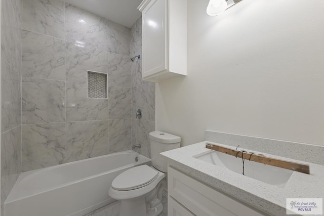 full bath with toilet, vanity, and  shower combination