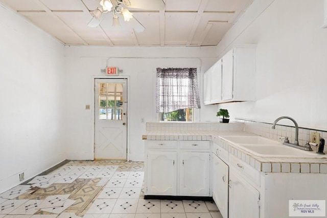 kitchen with white cabinets and sink