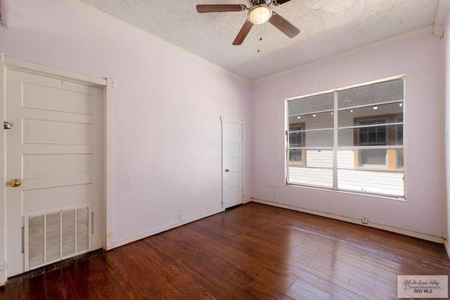 unfurnished room with ceiling fan, dark hardwood / wood-style flooring, crown molding, and a textured ceiling