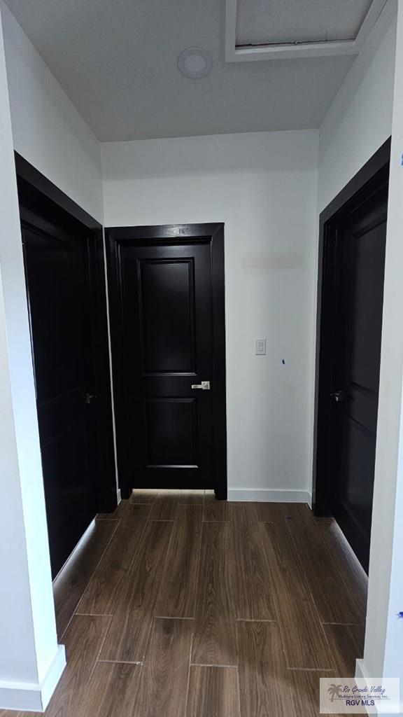 hallway featuring dark hardwood / wood-style floors