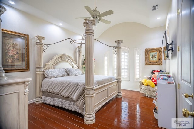 bedroom with ceiling fan, lofted ceiling, and dark wood-type flooring