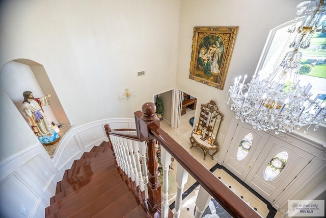 staircase featuring wood-type flooring