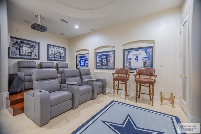 home theater featuring hardwood / wood-style flooring