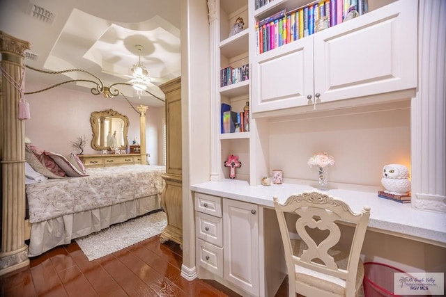 bedroom with dark hardwood / wood-style floors