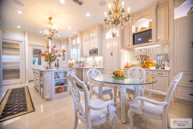 dining area featuring a notable chandelier and light tile patterned flooring