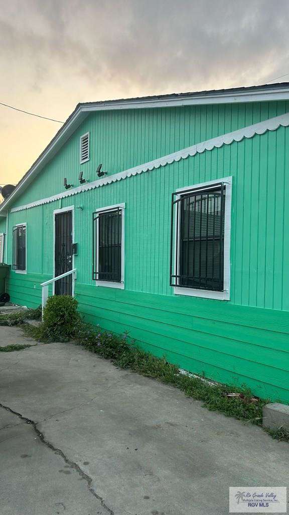 view of property exterior at dusk