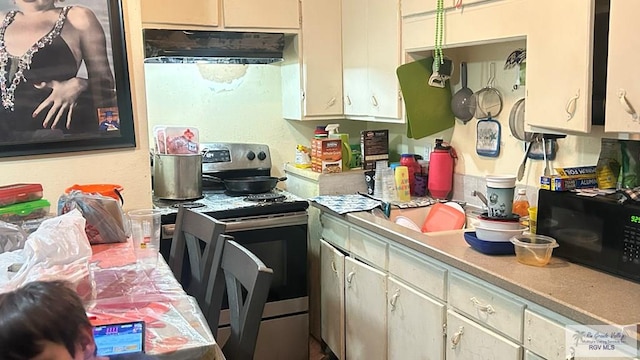 kitchen featuring stainless steel range with electric stovetop