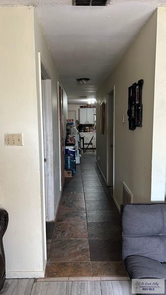 460 E Hicks St, San Benito, TX 78586 - hallway featuring dark hardwood / wood-style floors
