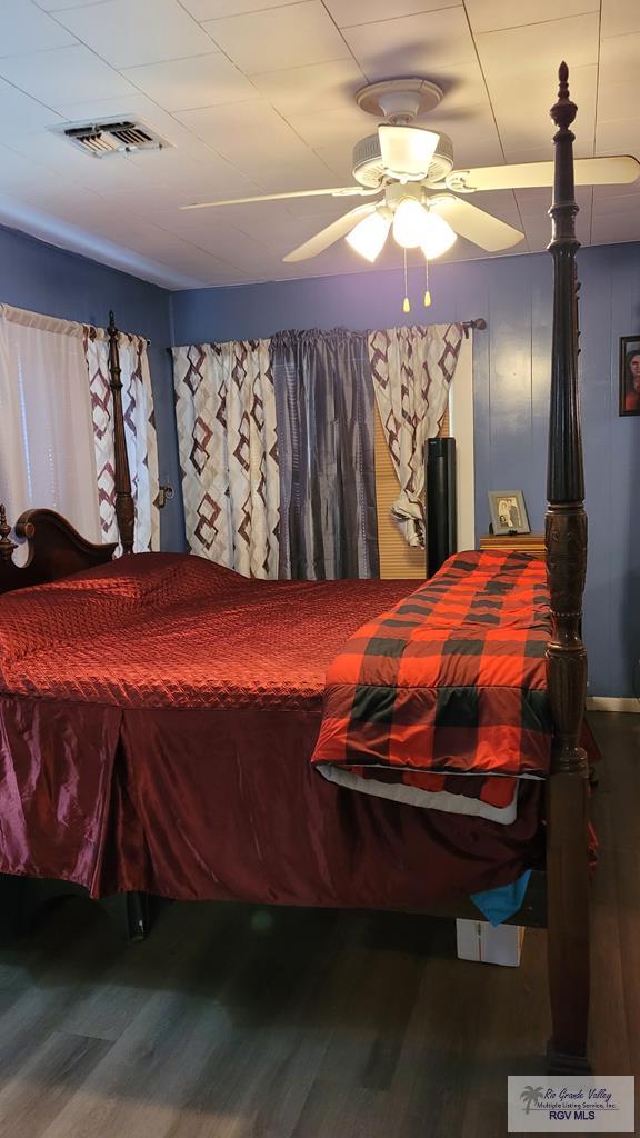 409 E Pine Ave Unit 0, La Feria, TX 78559 - bedroom with wood finished floors and ceiling fan