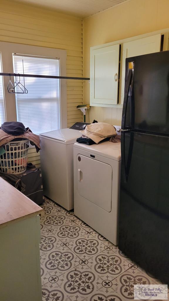 409 E Pine Ave Unit 0, La Feria, TX 78559 - laundry area featuring cabinet space and separate washer and dryer