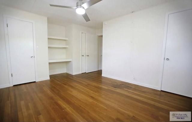 unfurnished bedroom with ceiling fan and dark hardwood / wood-style flooring