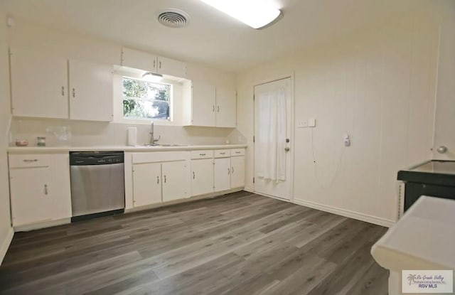 kitchen featuring dishwasher, white cabinetry, sink, and dark wood-type flooring