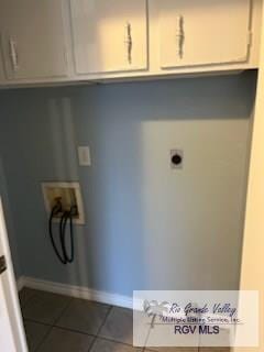 laundry room featuring cabinets, hookup for a washing machine, tile patterned flooring, and electric dryer hookup