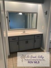 bathroom with vanity and tile patterned floors