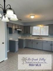 kitchen featuring light tile patterned floors and exhaust hood