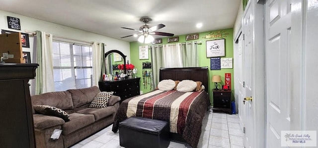 bedroom featuring light tile patterned floors and a ceiling fan