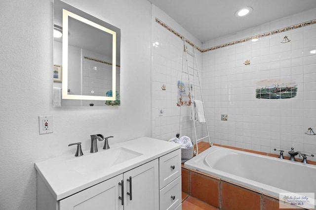 131 Windward Dr, Port Isabel, TX 78578 - full bathroom with vanity, a tub, and recessed lighting